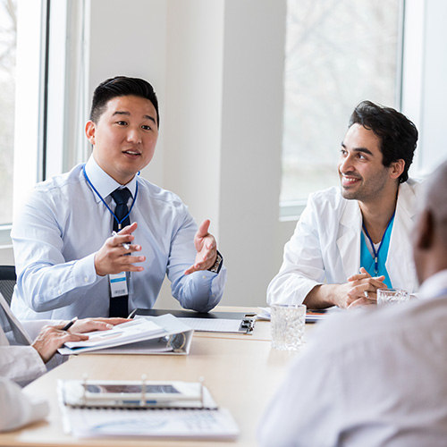 a practice holding a team meeting to discuss performance and results